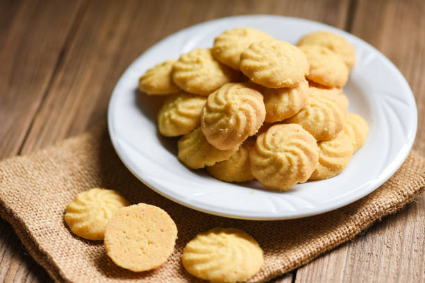 breakfast cookies vanilla on white plate and wooden background, mini cookies biscuits